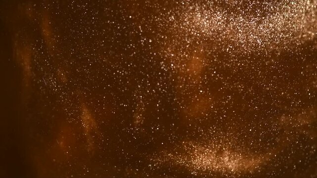 Gold particles floating background, Liquid gold, golden abstract backdrop. Golden dust abstract backdrop. Beautiful metallic yellow texture, swirls. Metallic paint closeup. Art Wallpaper waves surface