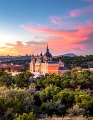Fototapeta premium Sunset view of a grand palace nestled within lush greenery, hills in the distance