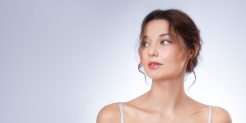 Fototapeta premium Natural Beauty Portrait of a Young Woman Looking Aside Thoughtfully in Soft