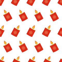 Red candles with snowflake designs create a festive pattern for winter decor and celebrations