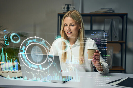 Businesswoman Analyzing Data With Holographic Interface In Modern Office, Coffee In Hand, Futuristic Visualization - Powered by Adobe