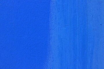Blue painted wall texture. Artistic urban surface background ideal for modern design, graphic layouts, artistic backdrops, architectural details, creative patterns and contemporary aesthetics