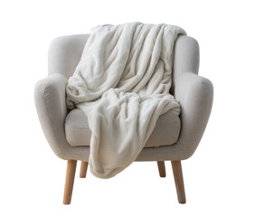 Cream-colored armchair with a draped blanket
