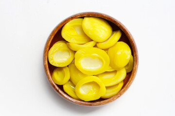 Sweet pickled Ma-Muang Bao (Thai small mango) halves without seed.