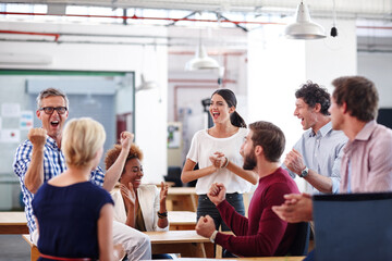 Success, team or people in office with applause, director feedback and pride for report. Smile, fist pump and marketing consultant in agency with tech, goal and research for consumer growth.