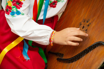Bandura is a Ukrainian folk stringed plucked musical instrument. A classical (diatonic) and modern (diatonic or chromatic) instrument from the harp, gusel, and psaltery family.