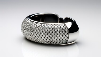 A photo of a sleek cuff with crystals.