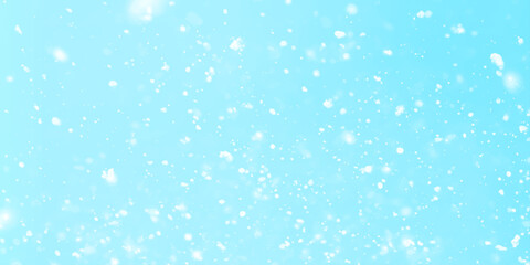 winter morning Snowflakes are falling from the sky randomly, Falling snow background on blue background, Blue snowfall background with soft falling snowflakes, winter seasonal atmosphere.