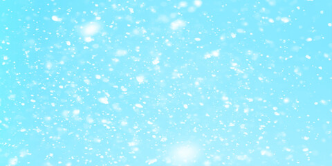 winter morning Snowflakes are falling from the sky randomly, Falling snow background on blue background, Blue snowfall background with soft falling snowflakes, winter seasonal atmosphere.