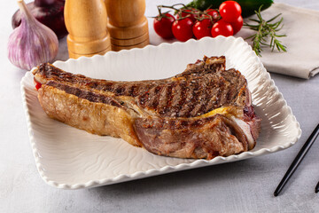 Grilled ribeye beef steak with bone