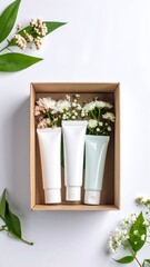 Three elegant white vases, each filled with vibrant, colorful flowers, are arranged on a rustic wooden table, creating a charming and fresh atmosphere.
