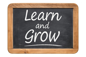 A chalkboard displaying the inspirational phrase "Learn and Grow" in white cursive lettering.