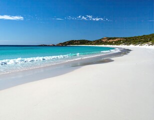 Pristine white sand beach curves gently into turquoise ocean under a vibrant blue sky; soft waves lap the shore