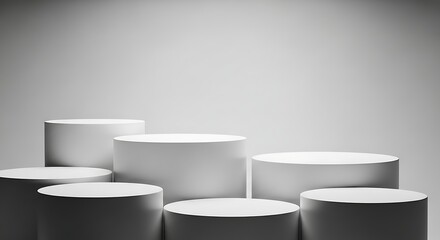 A minimalist stage with multiple cylindrical pedestals of varying heights, isolated on white background
