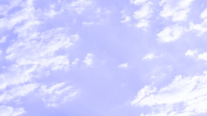 Purple sky with white cloud. Pastel colour backdrop of sunset sky. Beautiful nature. Summer color backgrounds concept. Copy space is on the right.