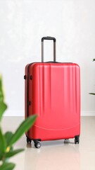 Red suitcase on floor