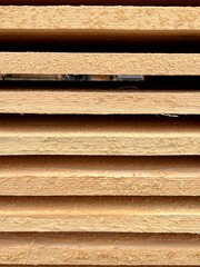 wooden boards stacked in a stack, side view
