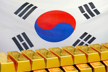 Row of gold bars on the South Korea flag background. Concept of gold reserve and gold fund of South Korea