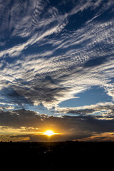 Dramatic sunset in the Sky through cumulus storm clouds,. Awesome epic landscape. Amazing vibrant colors, in Brazil