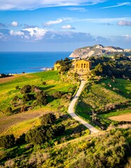 Panoramic view of ancient ruins overlooking a Mediterranean landscape