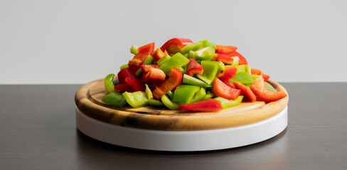 Sliced Green and Red Bell Peppers on Wooden Cutting Board