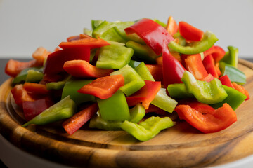 Sliced Green and Red Bell Peppers on Wooden Cutting Board