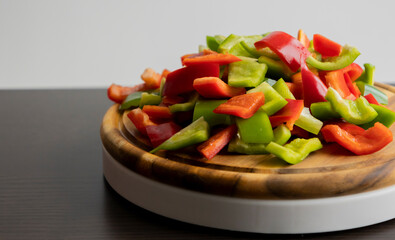 Sliced Green and Red Bell Peppers on Wooden Cutting Board