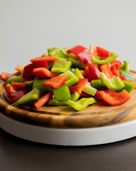 Sliced Green and Red Bell Peppers on Wooden Cutting Board
