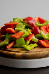 Sliced Green and Red Bell Peppers on Wooden Cutting Board