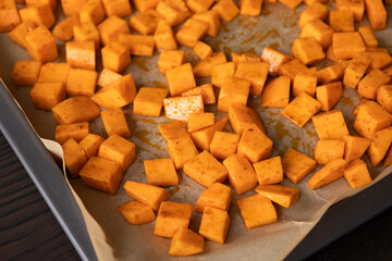 Seasoned Sweet Potato Cubes in Baking Tray Ready to Roast