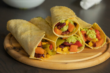 Corn Tortilla Tacos with Sweet Potato, Beans, Peppers and Smashed Avocado