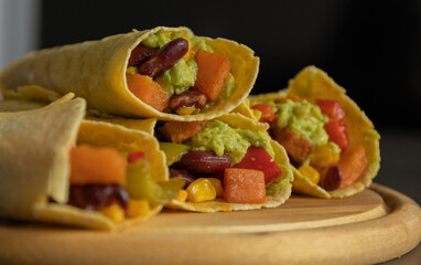 Corn Tortilla Tacos with Sweet Potato, Beans, Peppers and Smashed Avocado