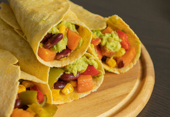 Corn Tortilla Tacos with Sweet Potato, Beans, Peppers and Smashed Avocado