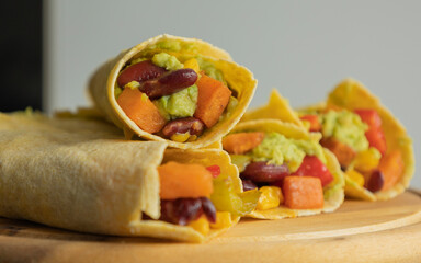Corn Tortilla Tacos with Sweet Potato, Beans, Peppers and Smashed Avocado