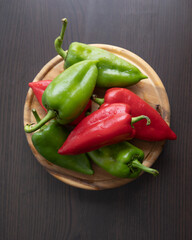Fresh Green and Red Bell Peppers on Rustic Wooden Cutting Board