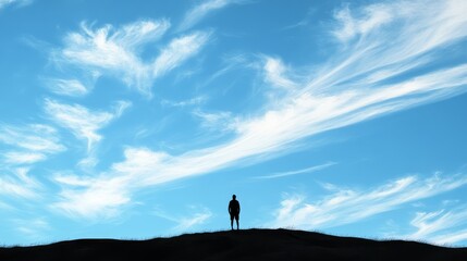 Subject silhouette at the top against a blue sky background with brush stroke clouds, Ample copy space at the bottom for text.
