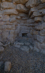 Nuraghe Piscu megalithic stone tower ruins in Suelli, Sardinia, under clear blue sky