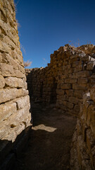 Nuraghe Piscu megalithic stone tower ruins in Suelli, Sardinia, under clear blue sky