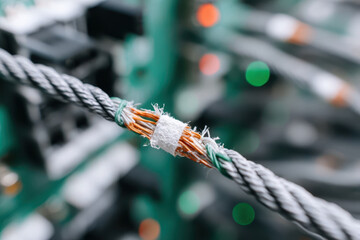 Economic Sanctions Concept,Close up of frayed steel wire rope with damaged economic condition due to sanctions showing broken strands against