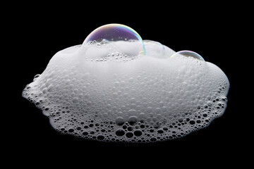 Iridescent soap bubbles cluster on a black background with glittering hues.