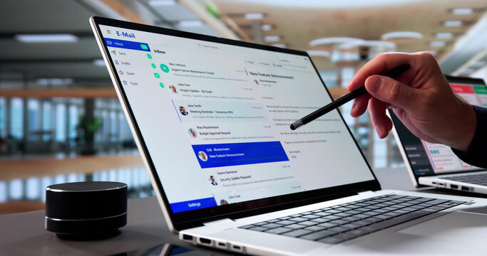 Senior Businessman Multitasking On Laptop, Checking Emails - Powered by Adobe