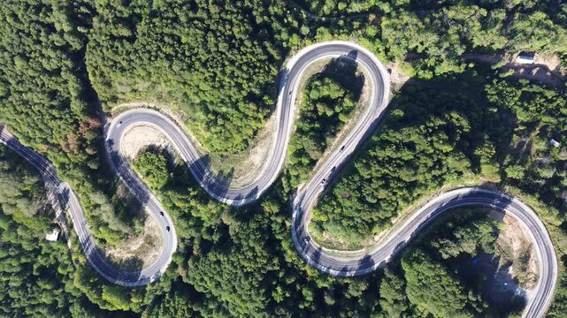 Aerial view of winding asphalt mountain road among green trees in summer. (Domani&ccedil;,İneg&ouml;l dağ yolu)	