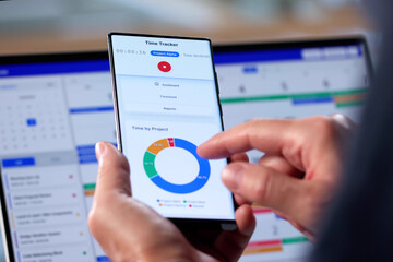 Senior Man Utilizing Digital Time Management App