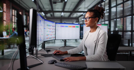 African American Business Manager Organizing Gantt Charts
