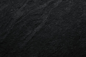 Charcoal volcanic stone texture showcases rich, dark surface with subtle variations, perfect for backgrounds or design elements. Its natural beauty adds depth and elegance to any project