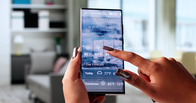 Checking The Weather Forecast On A Black Smartphone - Powered by Adobe