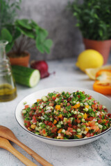 A bowl with traditional israeli Salad