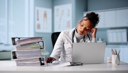 Doctor In A Hospital Crisis Overwhelmed By Paperwork And Stress