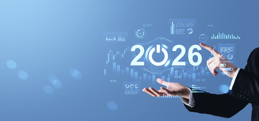 2026 digital future concept with businessman's hands and futuristic data graphs on blue background symbolizing innovation and economic evolution.