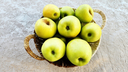 Apples in a basket, Golden Delicious is one of the top varieties of cultivar of apple